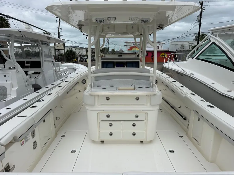 Slide: The Image of 2019 Mako 334 CC boat interior with center console and storage drawers. - 5