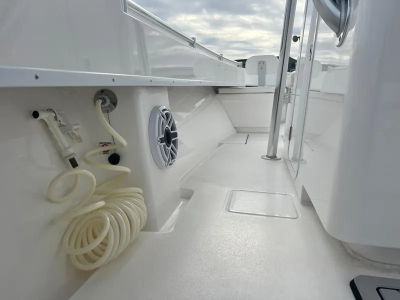Slide: The Image of 2023 Contender 30T boat interior with hose and speaker, showcasing sleek design. - 10