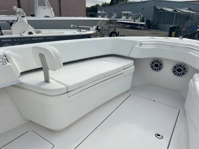Slide: The Image of 2023 Contender 30T boat interior with white seating and speakers. - 16