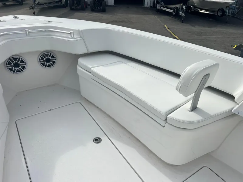 Slide: The Image of 2023 Contender 30T boat interior with white seating and speakers. - 17