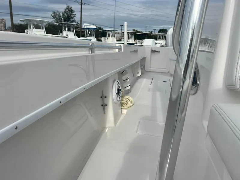 Slide: The Image of 2023 Contender 30T boat interior, showcasing sleek design and spacious deck area. - 19