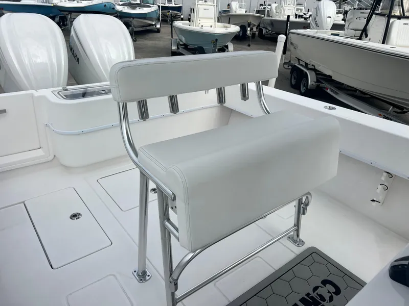 Slide: The Image of 2023 Contender 30T boat interior with white seating and dual engines. - 9