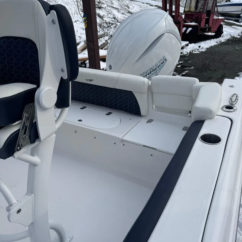 Slide: The Image of 2025 Tidewater 220 LXF boat interior with Yamaha engine, featuring sleek seating and design. - 12