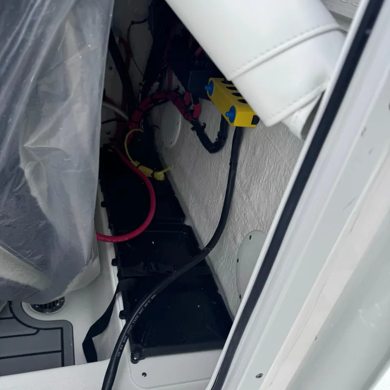 Slide: The Image of 2025 Tidewater 220 LXF interior wiring and components detail. - 15