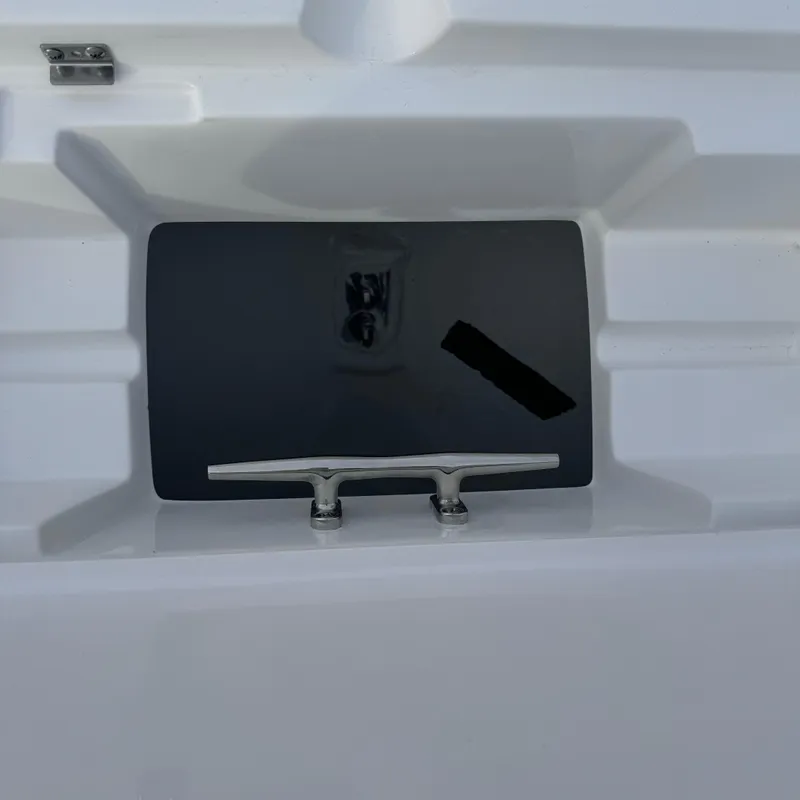 Slide: The Image of 2025 Tidewater 220 LXF boat cleat on sleek white surface. - 16