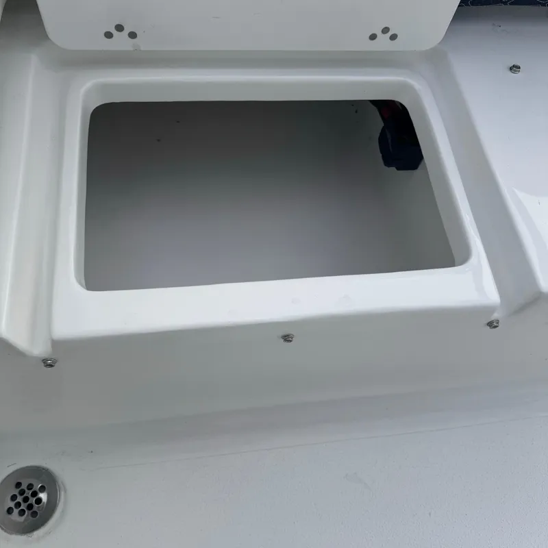 Slide: The Image of Open storage compartment on 2025 Tidewater 220 LXF boat. - 26
