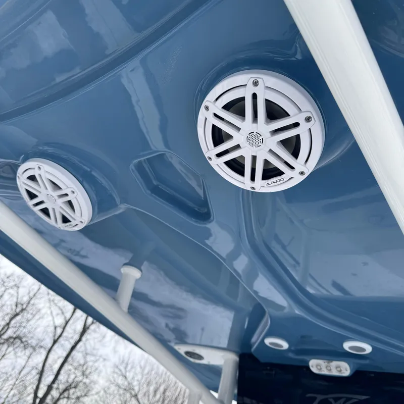 Slide: The Image of 2025 Tidewater 220 LXF boat speakers on blue interior ceiling. - 30