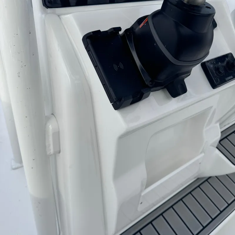 Slide: The Image of Close-up of 2025 Tidewater 220 LXF boat console with steering controls. - 32