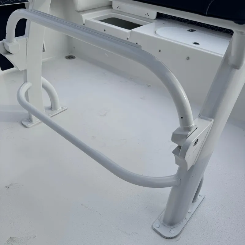 Slide: The Image of Tidewater 220 LXF 2025 boat interior with white railing and seating area. - 33