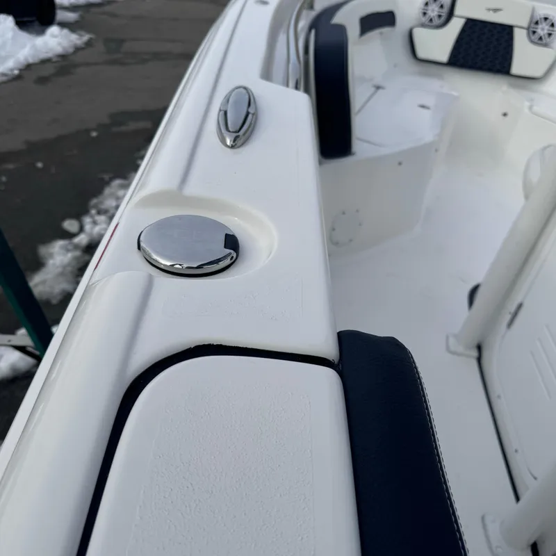 Slide: The Image of 2025 Tidewater 220 LXF boat interior, featuring sleek white and navy design elements. - 35