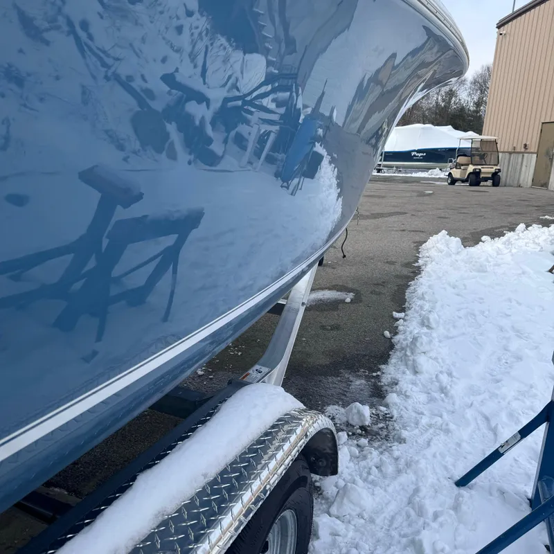 Slide: The Image of 2025 Tidewater 220 LXF boat on trailer in snowy outdoor setting. - 9