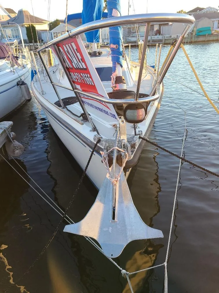 Slide: The Image of 1985 O'Day 35 sailboat docked, featuring a "For Sale" sign on the deck. - 7