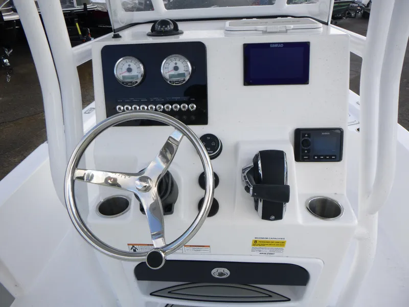 Slide: The Image of 2025 Sea Pro 230 Bay boat seats with white upholstery and SP logo. - 14
