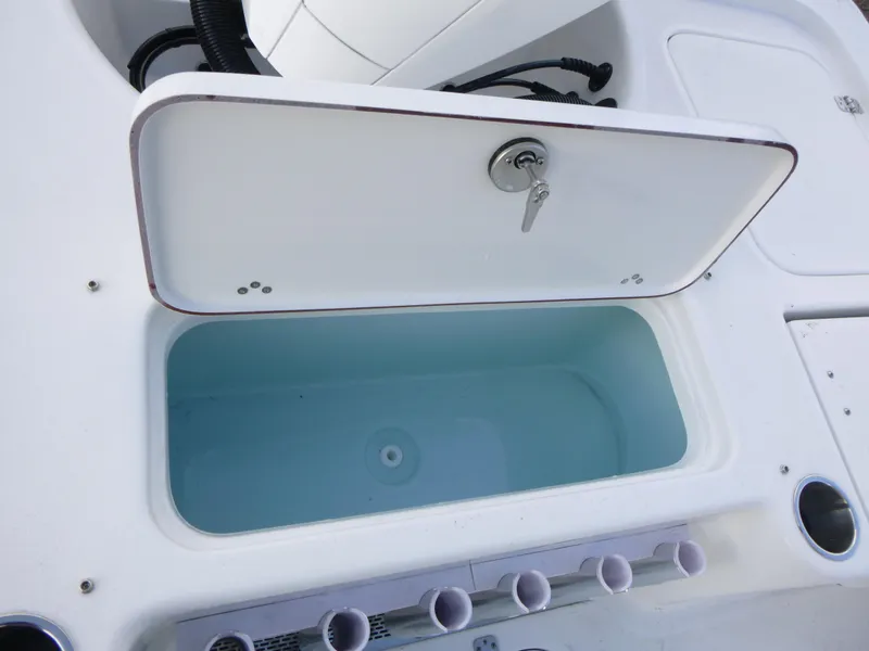 Slide: The Image of Open storage compartment on 2025 Sea Pro 230 Bay boat, showcasing interior design. - 18