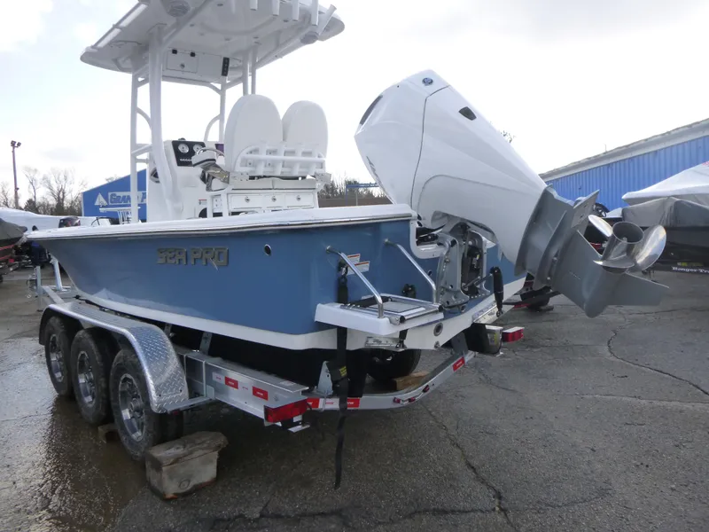 Slide: The Image of 2025 Sea Pro 230 Bay boat parked in an empty lot, rear view. - 5