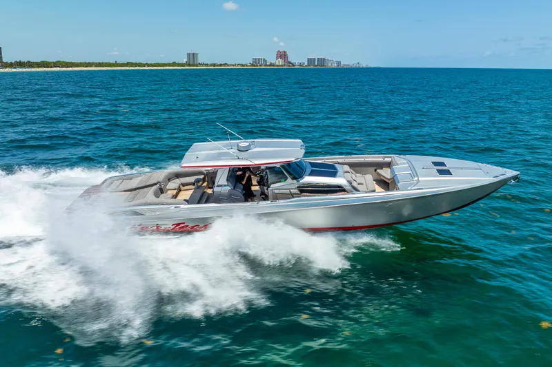 Slide: The Image of 2018 Nor-Tech 560 Sport Center Console cruising on open water. - 10