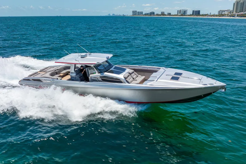 Slide: The Image of 2018 Nor-Tech 560 Sport Center Console cruising on open water. - 13