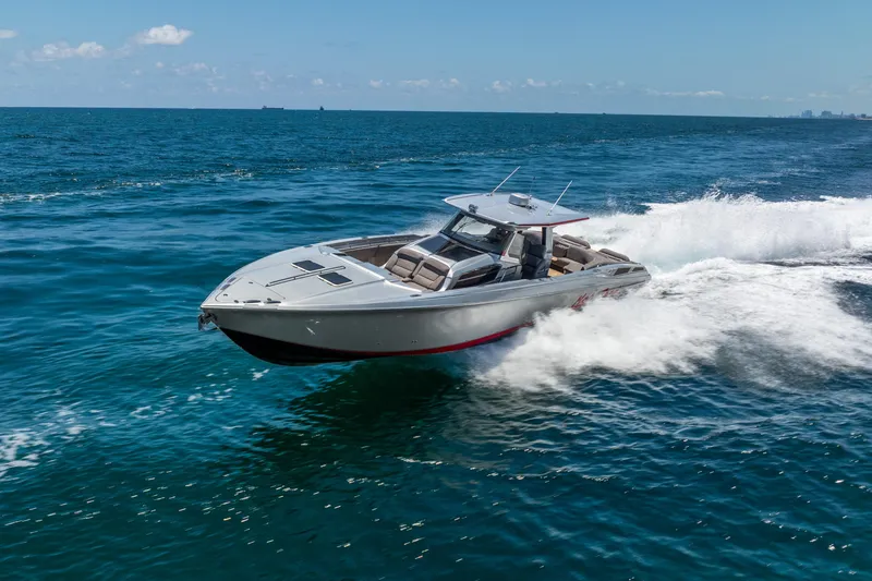 Slide: The Image of 2018 Nor-Tech 560 Sport Center Console cruising on open ocean waters. - 15