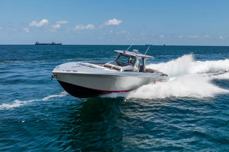 Slide: The Image of 2018 Nor-Tech 560 Sport Center Console cruising on open ocean waters. - 16