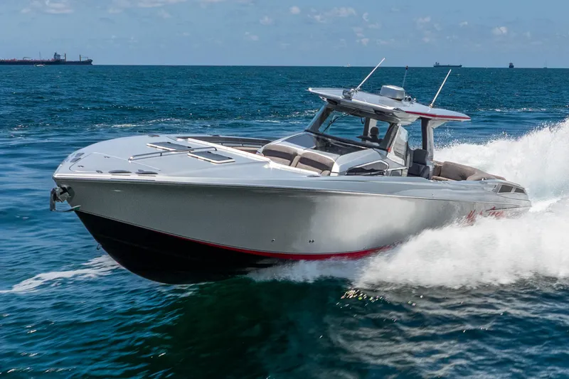 Slide: The Image of 2018 Nor-Tech 560 Sport Center Console cruising on open water. - 17