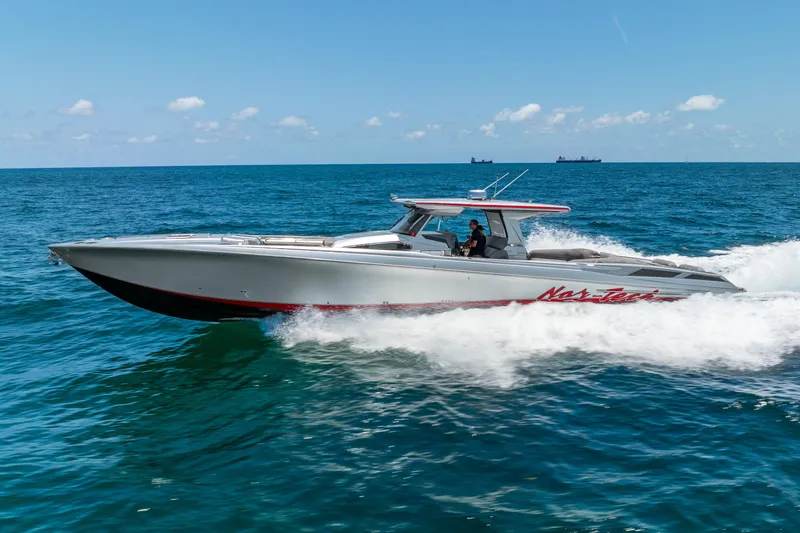 Slide: The Image of 2018 Nor-Tech 560 Sport Center Console cruising on open ocean waters. - 20