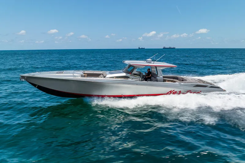 Slide: The Image of 2018 Nor-Tech 560 Sport Center Console cruising on open ocean waters. - 21