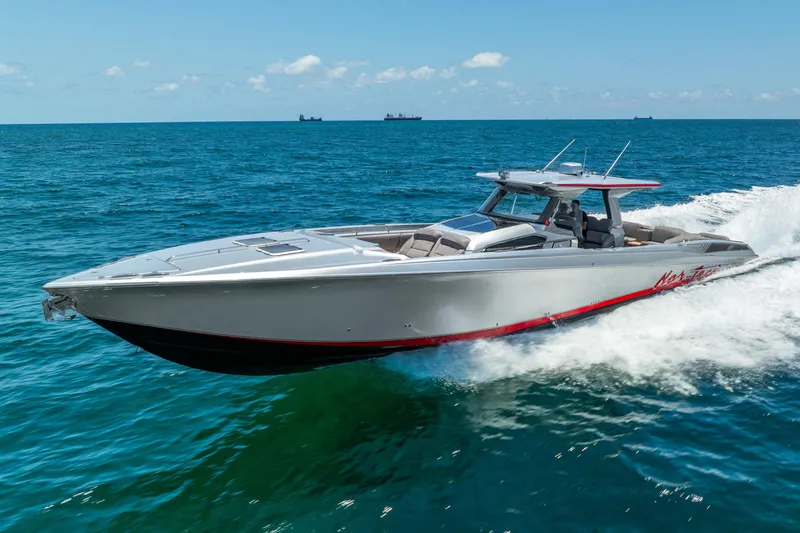 Slide: The Image of 2018 Nor-Tech 560 Sport Center Console cruising on open ocean waters. - 22
