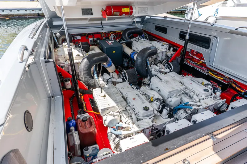 Slide: The Image of Engine compartment of a 2018 Nor-Tech 560 Sport Center Console boat. - 27