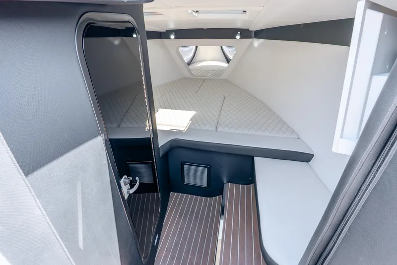 Slide: The Image of 2018 Nor-Tech 560 Sport Center Console cabin interior with modern design and comfortable seating. - 31