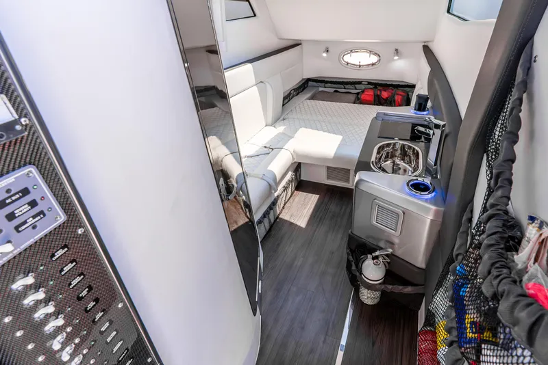 Slide: The Image of Luxurious interior of 2018 Nor-Tech 560 Sport Center Console with modern amenities and sleek design. - 39