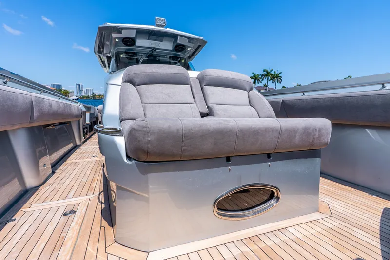 Slide: The Image of 2018 Nor-Tech 560 Sport Center Console with plush seating on a wooden deck. - 42