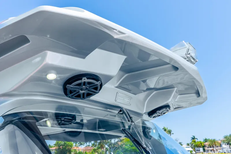 Slide: The Image of 2018 Nor-Tech 560 Sport Center Console boat roof with speakers and lights. - 43