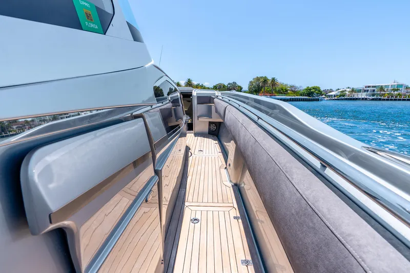Slide: The Image of 2018 Nor-Tech 560 Sport Center Console yacht with sleek deck design, cruising on a sunny day. - 44