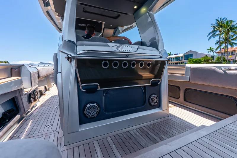 Slide: The Image of 2018 Nor-Tech 560 Sport Center Console boat interior with sleek design and modern amenities. - 49