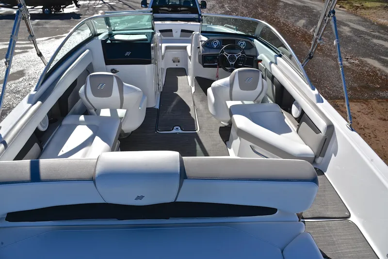 Slide: The Image of 2021 Four Winns HD3 boat interior with white seating and modern dashboard. - 18