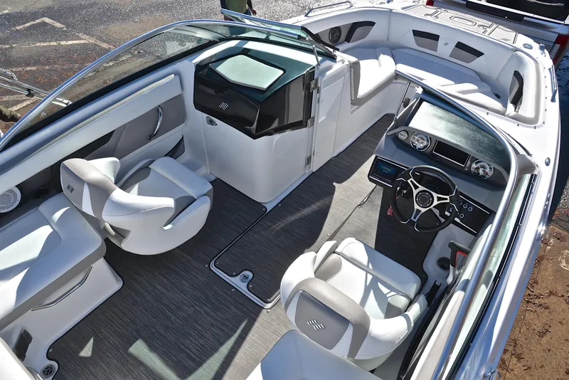 Slide: The Image of 2021 Four Winns HD3 boat interior with modern seating and dashboard design. - 19