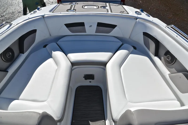 Slide: The Image of 2021 Four Winns HD3 boat interior with white seating and modern design. - 21
