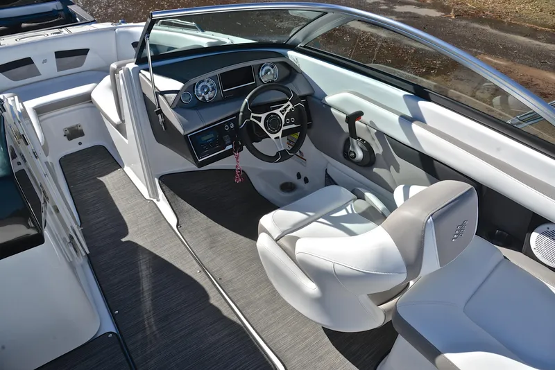 Slide: The Image of 2021 Four Winns HD3 boat interior with sleek dashboard and comfortable seating. - 25