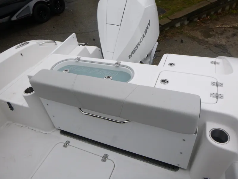 Slide: The Image of 2025 Sea Pro 242 Center Console boat with Mercury engine, featuring a cushioned bench seat. - 12