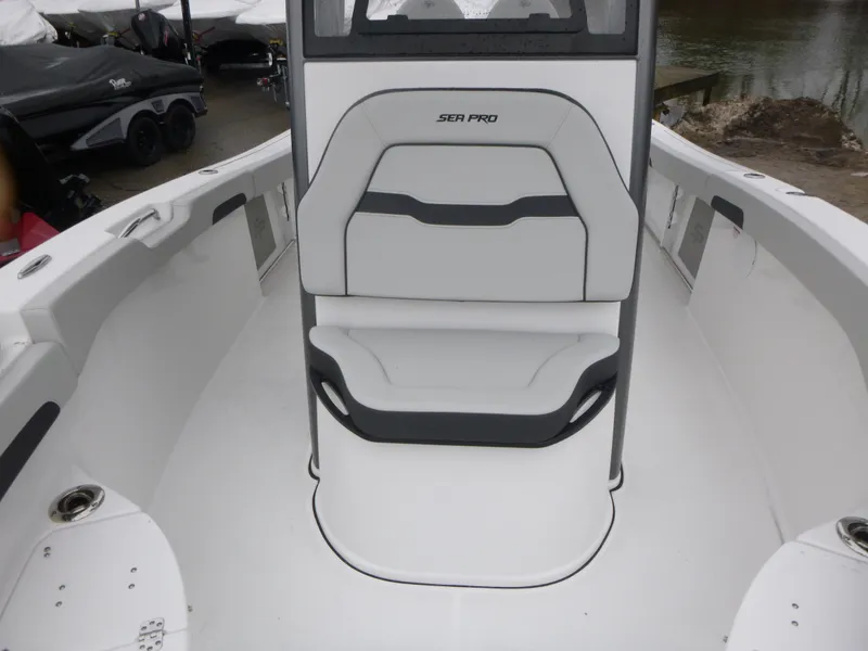 Slide: The Image of 2025 Sea Pro 242 Center Console boat interior with seating and console view. - 20