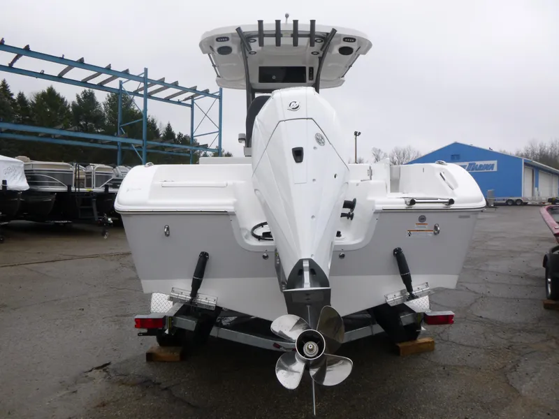 Slide: The Image of 2025 Sea Pro 242 Center Console boat, rear view, parked outdoors. - 6