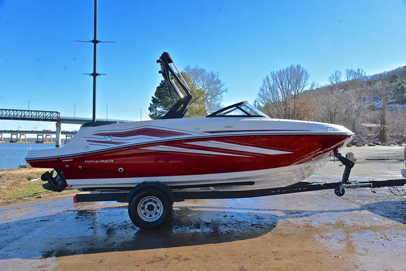 Slide: The Image of 2020 Bayliner VR5 boat on trailer by riverside, red and white design. - 11