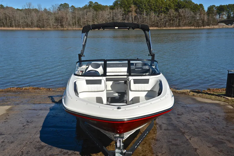 Slide: The Image of 2020 Bayliner VR5 boat on trailer by a serene lake. - 13