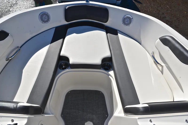 Slide: The Image of 2020 Bayliner VR5 boat interior with cushioned seating and cup holders. - 17