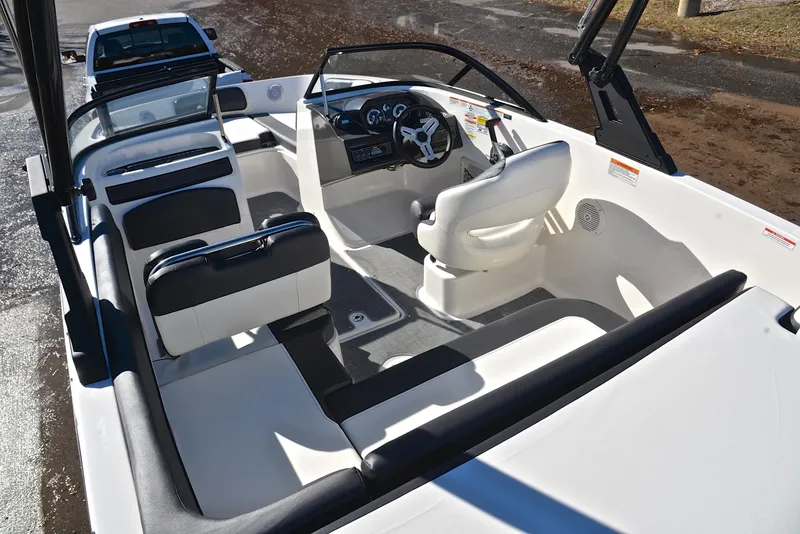 Slide: The Image of 2020 Bayliner VR5 boat interior with steering wheel and seating. - 19