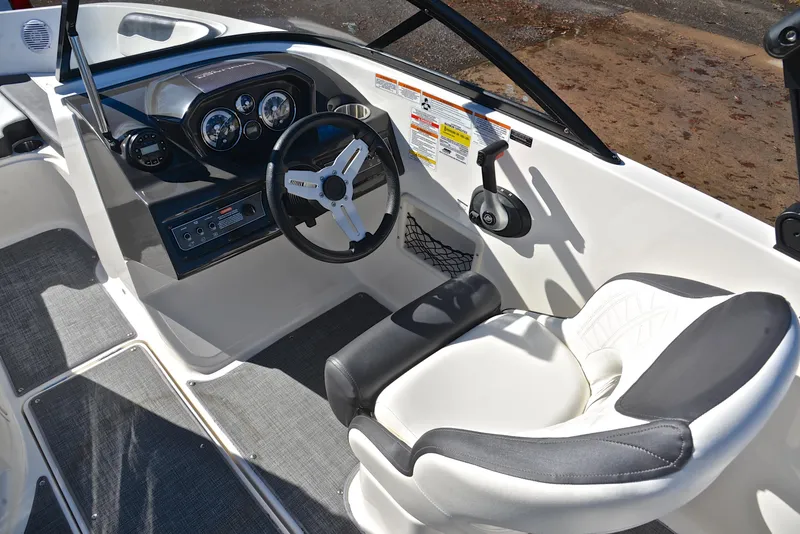 Slide: The Image of 2020 Bayliner VR5 boat interior with steering wheel and captain's seat. - 20