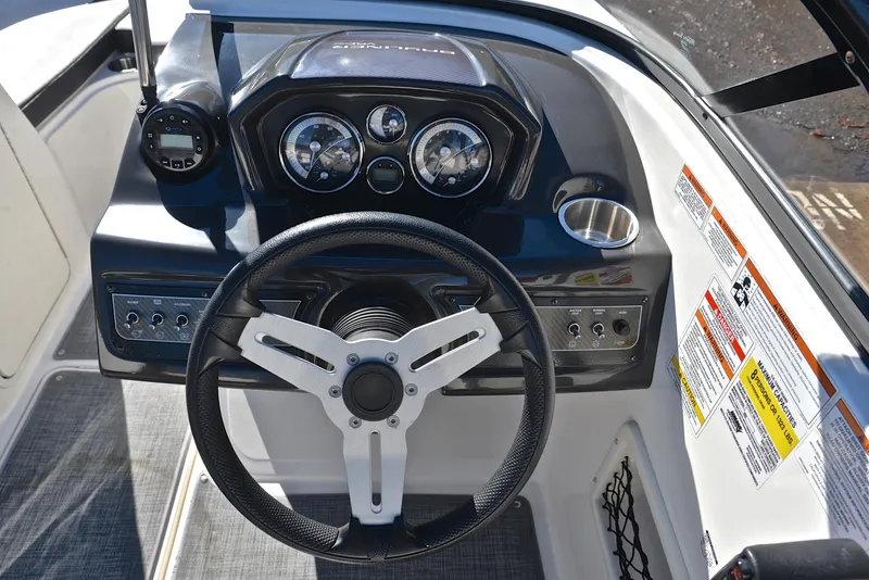 Slide: The Image of 2020 Bayliner VR5 boat dashboard with steering wheel and instrument panel. - 21