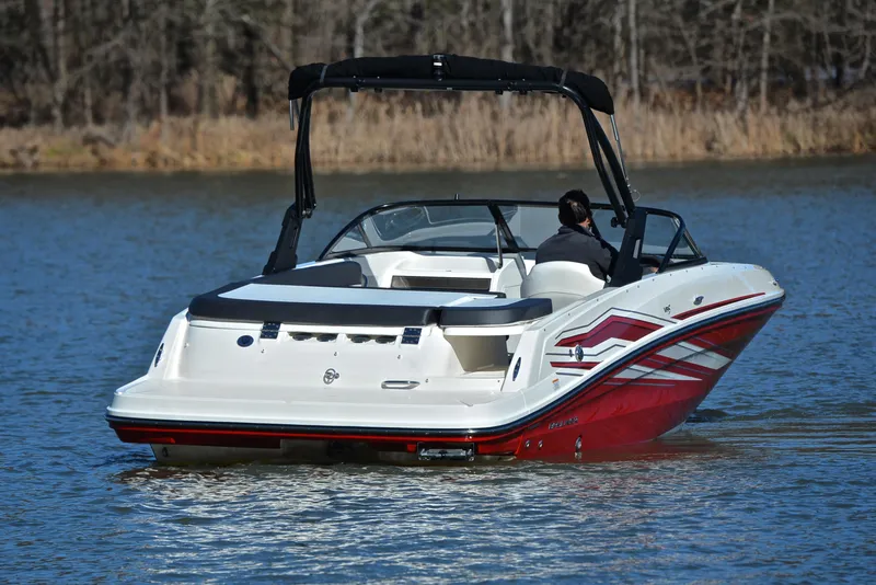 Slide: The Image of 2020 Bayliner VR5 boat on a calm lake, featuring sleek design and red accents. - 4
