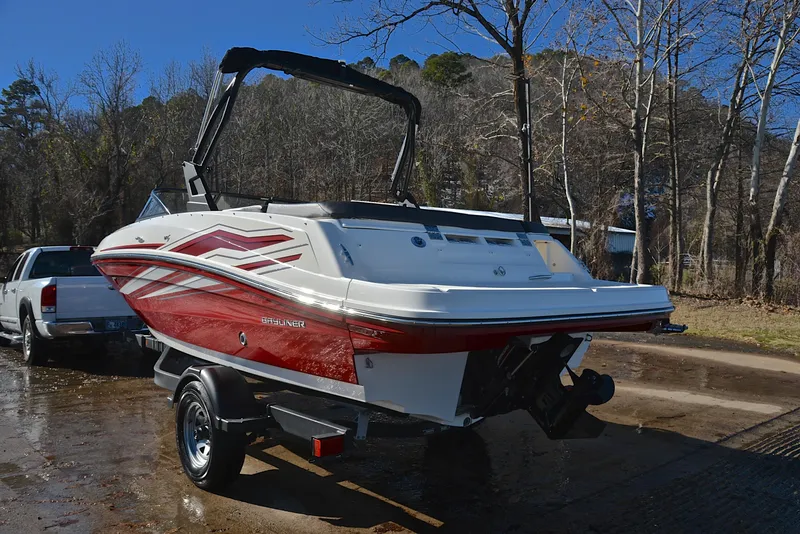 Slide: The Image of 2020 Bayliner VR5 boat on trailer, red and white design, parked outdoors. - 8