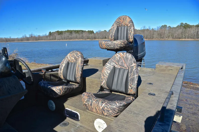 Slide: The Image of 2016 G3 Eagle 176 boat with camo seats on a lake. - 18